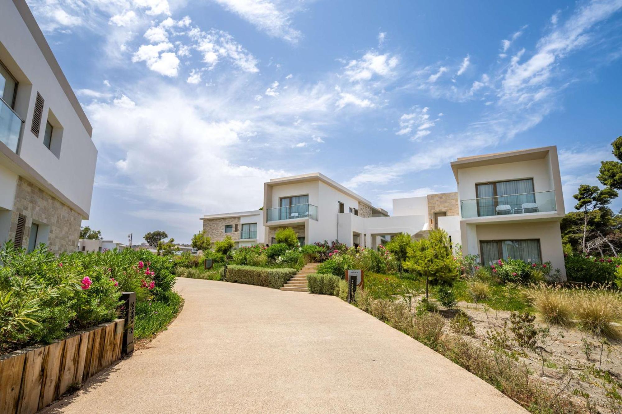 Radisson Blu Resort Аль-Хосейма Екстер'єр фото The resort's villas