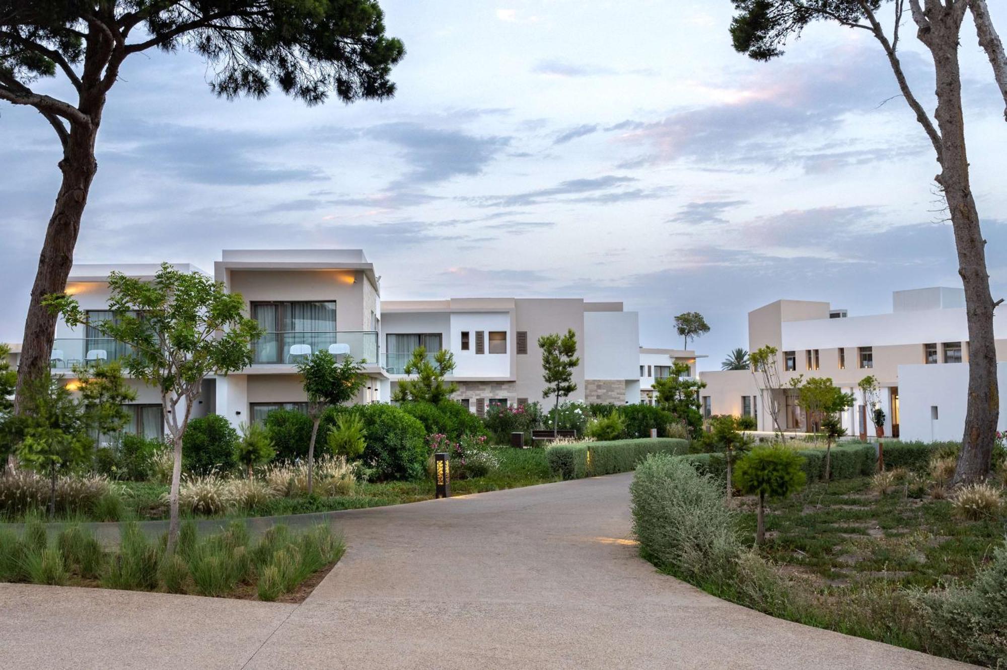 Radisson Blu Resort Аль-Хосейма Екстер'єр фото The resort's villas